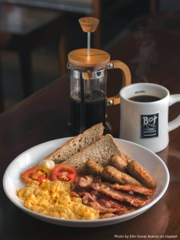 A breakfast plate with coffee.
